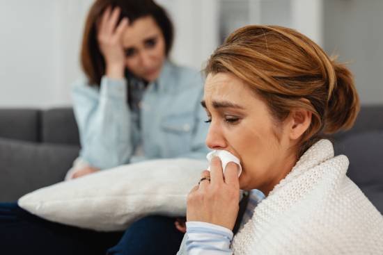 woman grieving during counselling session